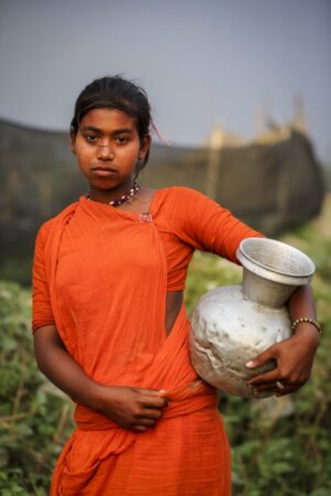 G.M.B. Akash. A young Bede (Beday) girl near a river.